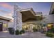 Elegant home with striking stone chimney, beautiful landscaping, and charming brick driveway at 36389 N 105Th Pl, Scottsdale, AZ 85262