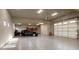 Clean and spacious garage with epoxy flooring, vehicle parking, and ample overhead lighting at 36389 N 105Th Pl, Scottsdale, AZ 85262