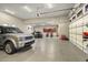 Well-lit garage features clean epoxy floors, multiple vehicles, and a convenient overhead door at 36389 N 105Th Pl, Scottsdale, AZ 85262