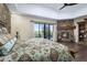 Primary bedroom with stone accent wall, fireplace, and private patio access at 36389 N 105Th Pl, Scottsdale, AZ 85262
