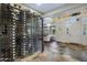 Stunning glass-enclosed wine cellar and front entryway with decorative stone flooring at 36389 N 105Th Pl, Scottsdale, AZ 85262