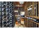 Custom wine cellar features wooden racks and temperature control for optimal storage at 36389 N 105Th Pl, Scottsdale, AZ 85262