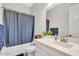 Bathroom featuring a single vanity with a white cabinet and a shower with a blue curtain at 3648 E Arabian Dr, Gilbert, AZ 85296