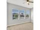 Bedroom featuring neutral carpet and paint, and three windows with blinds at 3648 E Arabian Dr, Gilbert, AZ 85296