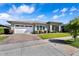 Well-maintained single-story home boasts a brick driveway and a beautifully landscaped front yard at 3648 E Arabian Dr, Gilbert, AZ 85296