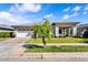 Charming single-story home featuring a well-manicured lawn and a covered porch with stone accents at 3648 E Arabian Dr, Gilbert, AZ 85296