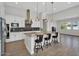 Well-appointed kitchen featuring a large center island with seating, pendant lighting, and stainless steel appliances at 3648 E Arabian Dr, Gilbert, AZ 85296