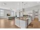 Open floor plan featuring living room and kitchen with a large center island at 3648 E Arabian Dr, Gilbert, AZ 85296