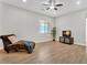 Bright living room featuring tile flooring, a window with blinds, a chaise lounge, and a ceiling fan at 3648 E Arabian Dr, Gilbert, AZ 85296