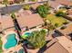 Beautiful aerial view showcases a home with inviting pools and lush greenery at 3841 E Redfield Ct, Gilbert, AZ 85234