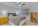 Cozy bedroom with carpet, a ceiling fan, a window, and a queen size bed at 3841 E Redfield Ct, Gilbert, AZ 85234