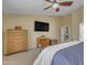 Comfortable bedroom with ample dresser storage and natural light from a bright window at 3841 E Redfield Ct, Gilbert, AZ 85234