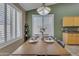 Bright dining room with large windows, stylish decor, and an adjacent serving station at 3841 E Redfield Ct, Gilbert, AZ 85234
