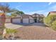 Inviting home featuring a three-car garage, desert landscaping, and a neutral color palette at 3841 E Redfield Ct, Gilbert, AZ 85234