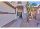 Charming home entrance featuring desert landscaping and a welcoming front porch with a wreath and welcome sign at 3841 E Redfield Ct, Gilbert, AZ 85234