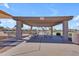 Community picnic area featuring shaded tables and seating under a covered pavilion on a clear day at 3841 E Redfield Ct, Gilbert, AZ 85234