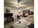 Cozy bedroom featuring tile floors, neutral paint and ceiling fan at 3937 W Stella Ln, Phoenix, AZ 85019