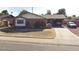 Modest single story home with brick accents, driveway, and covered parking at 3937 W Stella Ln, Phoenix, AZ 85019