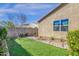 Backyard featuring lush green grass, mature landscaping and charming design elements at 4027 W Copperleaf Dr, San Tan Valley, AZ 85144