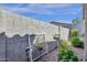 Landscaped backyard featuring a block wall with vegetation, gravel, and a small solar light at 4027 W Copperleaf Dr, San Tan Valley, AZ 85144