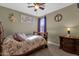 Cozy bedroom with natural light and a ceiling fan at 4027 W Copperleaf Dr, San Tan Valley, AZ 85144
