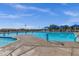 Community pool with lap lanes, lounge areas and umbrellas for shade at 4027 W Copperleaf Dr, San Tan Valley, AZ 85144