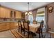 Cozy dining room featuring table set for four, built-in hutch, and sliding door to outdoor patio at 4027 W Copperleaf Dr, San Tan Valley, AZ 85144