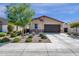 Charming single-story home featuring low maintenance desert landscaping, stone accents, and a spacious two-car garage at 4027 W Copperleaf Dr, San Tan Valley, AZ 85144
