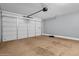 Spacious two-car garage with automatic door and ample room for storage or vehicles at 4027 W Copperleaf Dr, San Tan Valley, AZ 85144