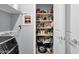 Laundry room with a modern washing machine, shelving and ample storage at 4027 W Copperleaf Dr, San Tan Valley, AZ 85144
