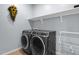 Modern laundry room equipped with high-end washer and dryer at 4027 W Copperleaf Dr, San Tan Valley, AZ 85144
