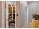Walk-in pantry featuring plenty of storage and shelving with a view of tiled hallway at 4027 W Copperleaf Dr, San Tan Valley, AZ 85144