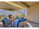 Inviting covered patio with comfortable seating, perfect for outdoor entertaining and relaxation at 4027 W Copperleaf Dr, San Tan Valley, AZ 85144