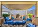 Inviting covered patio with comfortable seating, perfect for outdoor entertaining and relaxation at 4027 W Copperleaf Dr, San Tan Valley, AZ 85144