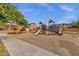 Neighborhood playground with play structures, soft ground cover, and nearby residential homes at 4027 W Copperleaf Dr, San Tan Valley, AZ 85144