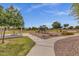 Community playground featuring play structures, shaded picnic areas, and walking paths at 4027 W Copperleaf Dr, San Tan Valley, AZ 85144