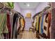 Spacious walk-in closet with ample hanging space and shelving for organized storage solutions at 4027 W Copperleaf Dr, San Tan Valley, AZ 85144