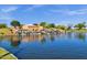 Community entrance fountain with cascading waterfall and serene lake at 4027 W Copperleaf Dr, San Tan Valley, AZ 85144