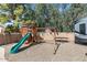 Backyard featuring a wooden playset with slide, swings, and trampoline, perfect for Gathering fun at 421 E Terrace Ave, Gilbert, AZ 85234