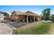 Spacious backyard featuring a covered patio, lush green lawn, and ample outdoor living space at 421 E Terrace Ave, Gilbert, AZ 85234