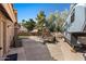Wide backyard with a recreational vehicle, playset, patio area, and concrete for parking at 421 E Terrace Ave, Gilbert, AZ 85234