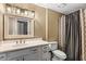 Bathroom featuring a classic vanity, a large mirror, and a shower with stylish curtain at 421 E Terrace Ave, Gilbert, AZ 85234