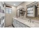 Bright bathroom featuring a double vanity, modern fixtures, and neutral-toned walls at 421 E Terrace Ave, Gilbert, AZ 85234