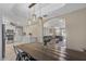 Open-concept dining area flows into kitchen and living room, perfect for gatherings, well lit with hanging lights at 421 E Terrace Ave, Gilbert, AZ 85234