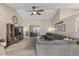 Spacious living area showcasing a vaulted ceiling, ceiling fan, decor, and comfortable sofa at 421 E Terrace Ave, Gilbert, AZ 85234