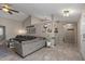 Open-concept living area with neutral colors, tile floors, decor and a comfortable sectional sofa at 421 E Terrace Ave, Gilbert, AZ 85234