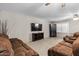 Spacious living room with brick wall, tile floor, and comfortable seating at 421 E Terrace Ave, Gilbert, AZ 85234
