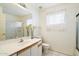 A bright bathroom with a single sink, a toilet and a shower at 4546 E Villa Rita Dr, Phoenix, AZ 85032