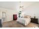 Cozy bedroom with plush carpeting, ceiling fan, and natural light at 4546 E Villa Rita Dr, Phoenix, AZ 85032
