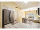 Well-lit kitchen with stainless steel appliances and tiled countertops at 4546 E Villa Rita Dr, Phoenix, AZ 85032